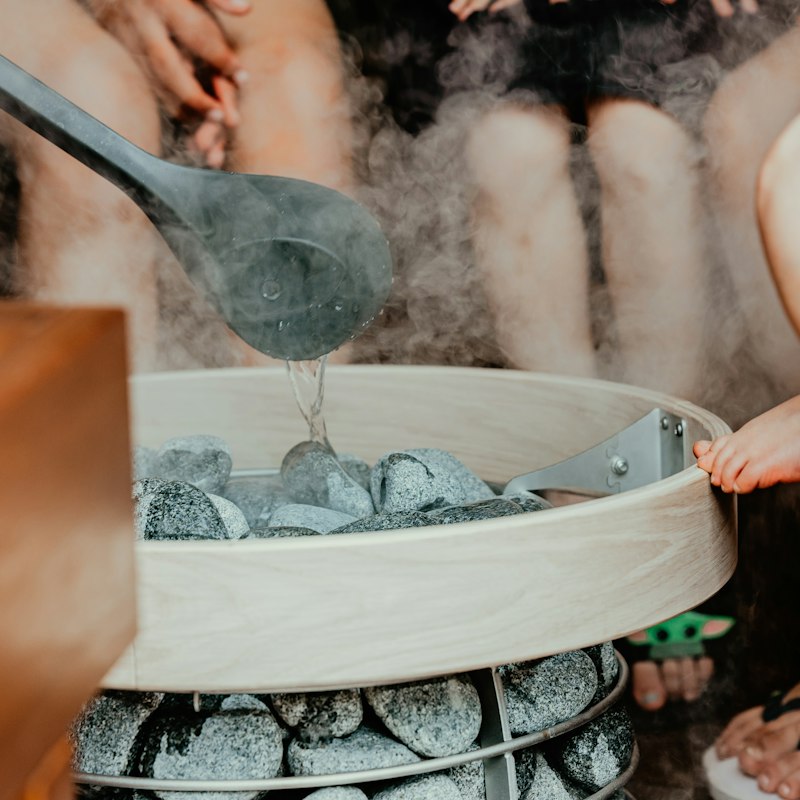 Water ladle beside a banya heater