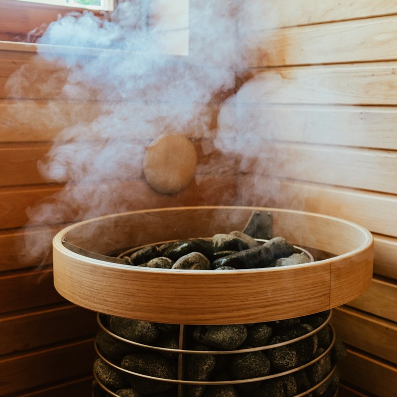 Steam rising from heated sauna stones