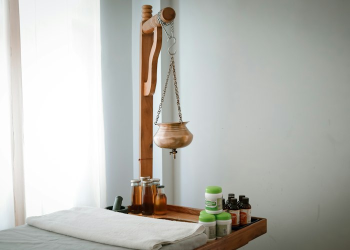 Shelf of massage oils and treatment supplies